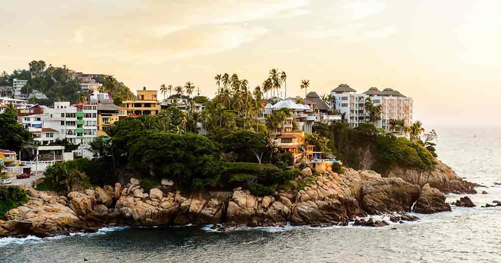 Acapulco - View from the sea to a rocky promontory on the coast